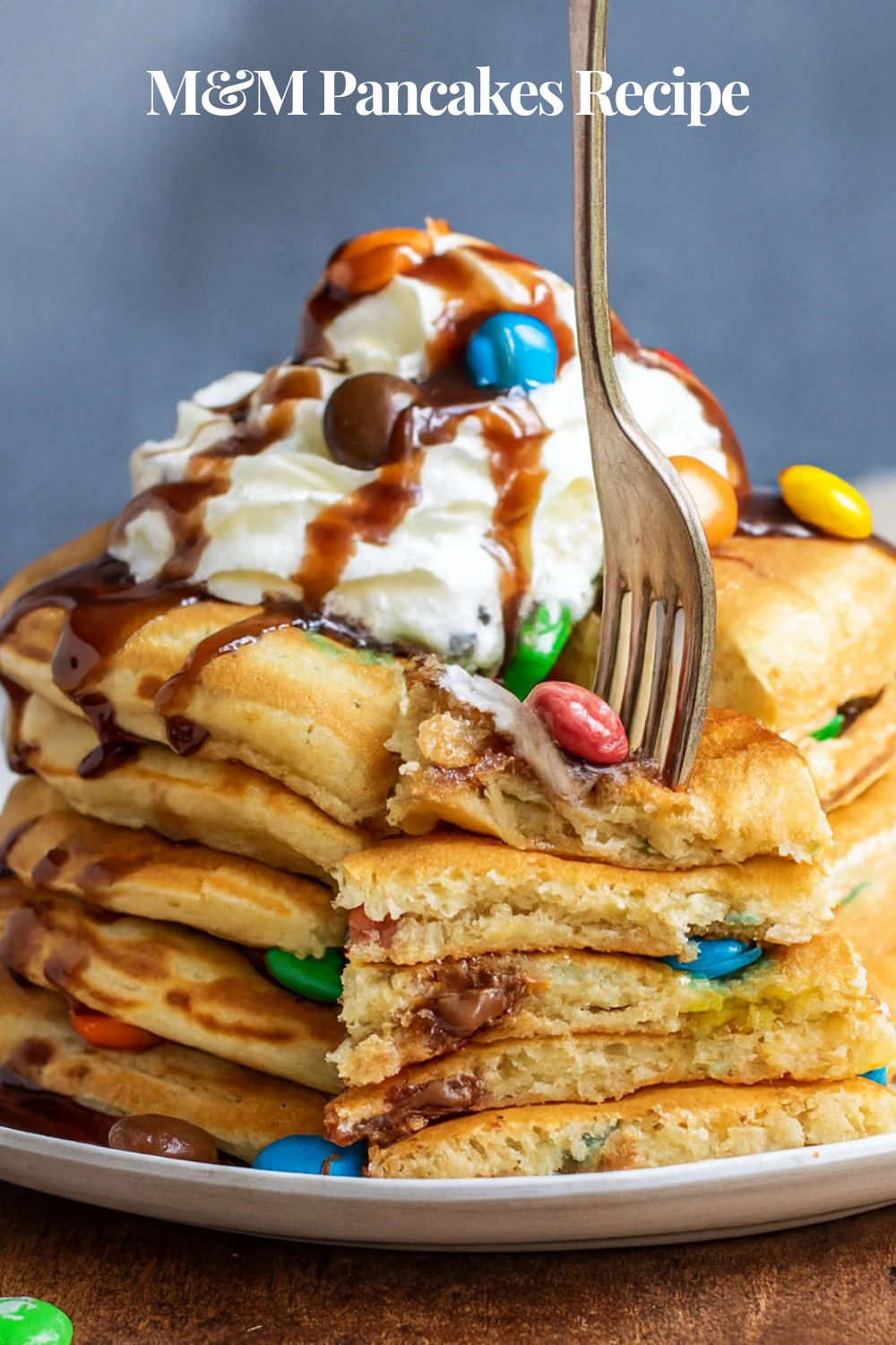 Stack of M&M pancakes with toppings